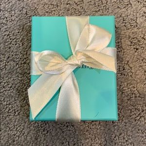 Tiffany blue box tied with a bow